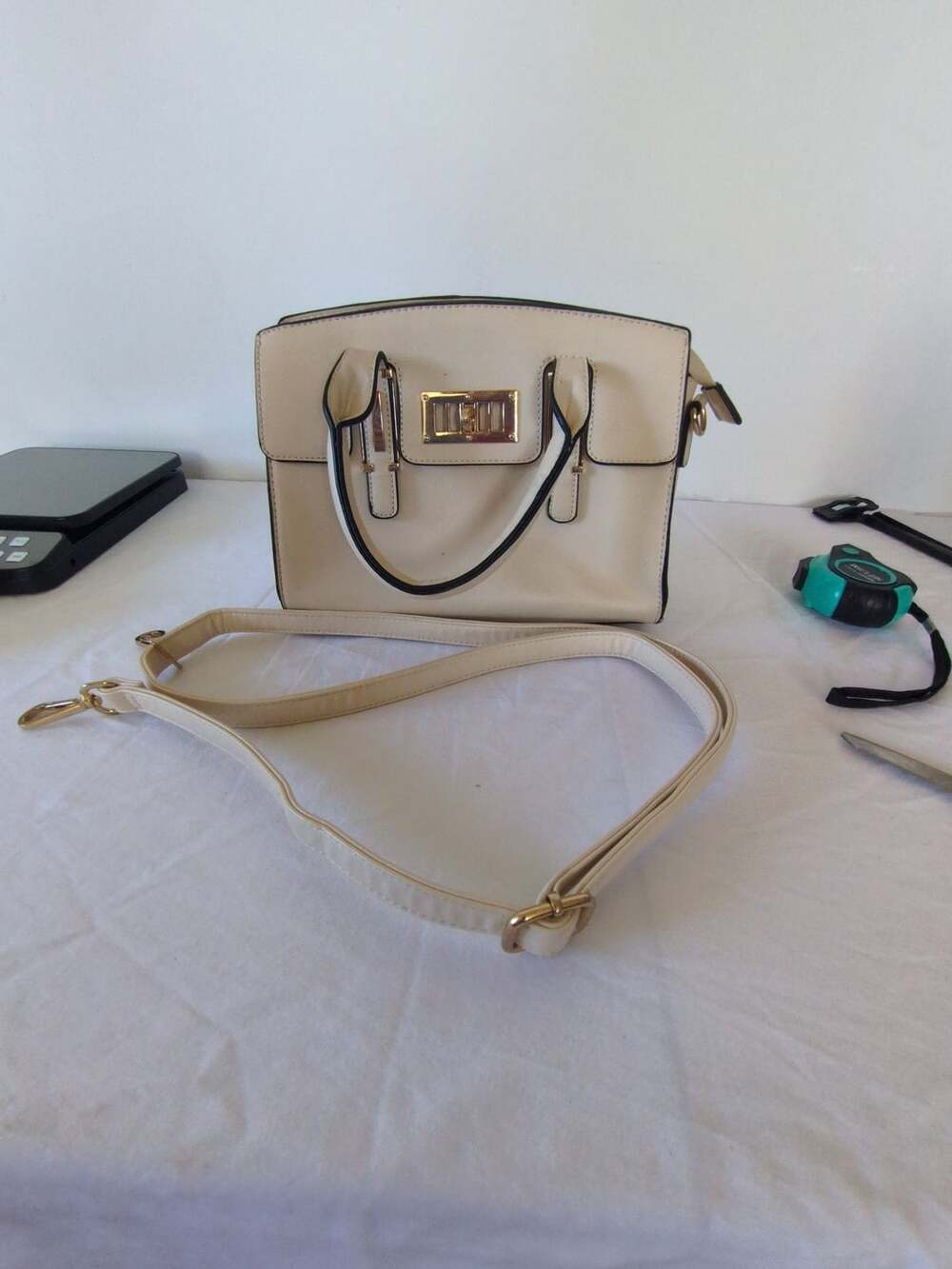 Off White Satchel Handbag With Gold Tone Hardware And Crossbody Strap
